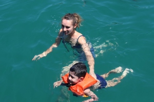 Bianca swimming with Logan at one of the stops during our cruise (Buzios)